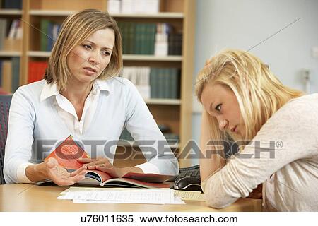 Stock Photography - College tutor with student. Fotosearch