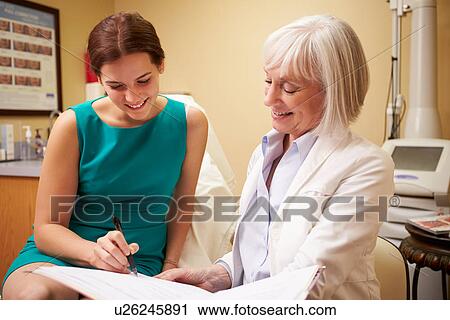 Cosmetic Surgeon Discussing Proceedure With Client In Office View Large Photo Image Stock Image - Cosmetic Surgeon Discussing Proceedure With Client In Office. Fotosearch