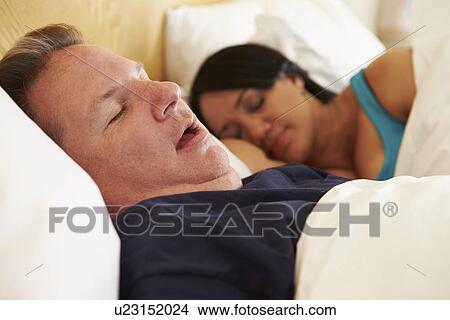 Couple Asleep In Bed With Man Snoring View Large Photo Image Picture - Couple Asleep In Bed With Man Snoring. Fotosearch