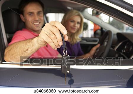 Couple buying new car View Large Photo Image Stock Image - Couple buying new car. Fotosearch