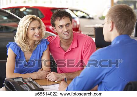 Couple buying new car View Large Photo Image Stock Image - Couple buying new car. Fotosearch