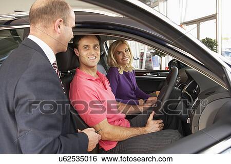 Couple buying new car View Large Photo Image Stock Photograph - Couple buying new car. Fotosearch