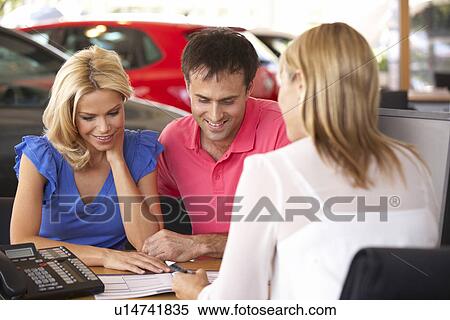 Stock Photography - Couple buying new car. Fotosearch