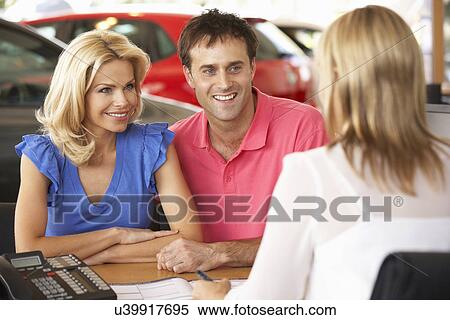 Couple buying new car View Large Photo Image Stock Photography - Couple buying new car. Fotosearch