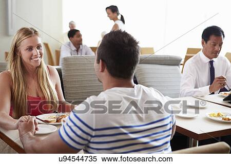 Stock Photography - Couple Enjoying Breakfast In Hotel Restaurant. Fotosearch