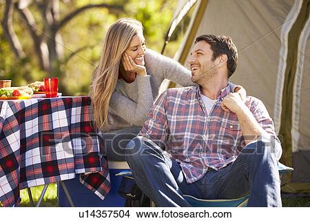 Couple Enjoying Camping Holiday In Countryside View Large Photo Image Picture - Couple Enjoying Camping Holiday In Countryside. Fotosearch