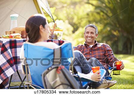 Couple Enjoying Camping Holiday In Countryside View Large Photo Image Picture - Couple Enjoying Camping Holiday In Countryside. Fotosearch