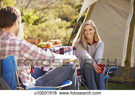 Stock Photo - Couple Enjoying Camping Holiday In Countryside. Fotosearch