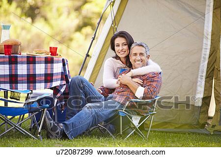 Stock Photo - Couple Enjoying Camping Holiday In Countryside. Fotosearch