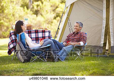 Couple Enjoying Camping Holiday In Countryside View Large Photo Image Stock Photograph - Couple Enjoying Camping Holiday In Countryside. Fotosearch