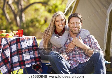 Couple Enjoying Camping Holiday In Countryside View Large Photo Image Stock Photography - Couple Enjoying Camping Holiday In Countryside. Fotosearch
