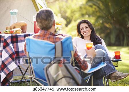 Couple Enjoying Camping Holiday In Countryside View Large Photo Image Stock Photography - Couple Enjoying Camping Holiday In Countryside. Fotosearch