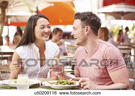 Couple Enjoying Lunch In Outdoor Restaurant View Large Photo Image Stock Photograph - Couple Enjoying Lunch In Outdoor Restaurant. Fotosearch