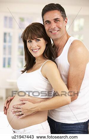 Couple expecting baby View Large Photo Image Stock Image - Couple expecting baby. Fotosearch