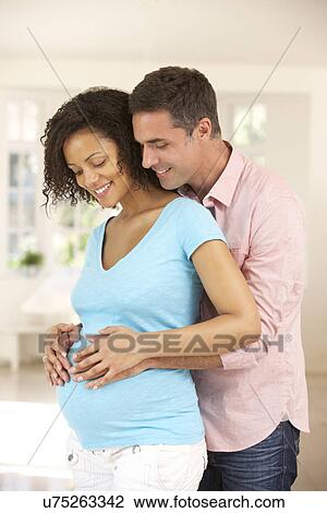 Couple expecting baby View Large Photo Image Stock Image - Couple expecting baby. Fotosearch
