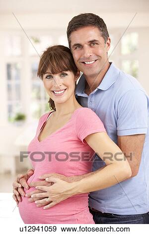 Stock Photo - Couple expecting baby. Fotosearch