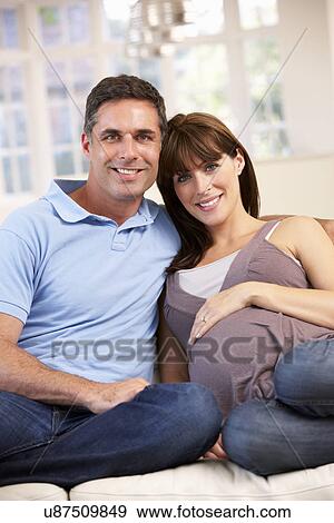 Stock Photo - Couple expecting baby. Fotosearch