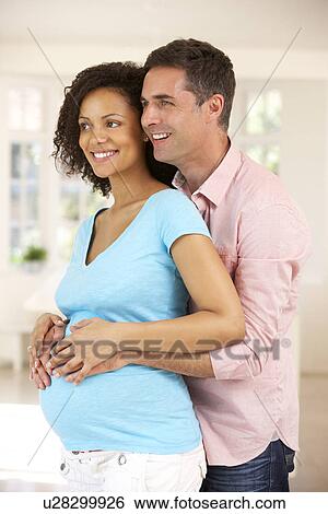 Couple expecting baby View Large Photo Image Stock Photograph - Couple expecting baby. Fotosearch
