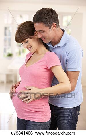 Couple expecting baby View Large Photo Image Stock Photograph - Couple expecting baby. Fotosearch