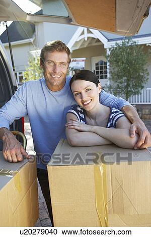 Couple moving house View Large Photo Image Stock Image - Couple moving house. Fotosearch