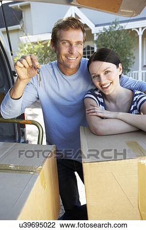 Couple moving house View Large Photo Image Stock Image - Couple moving house. Fotosearch