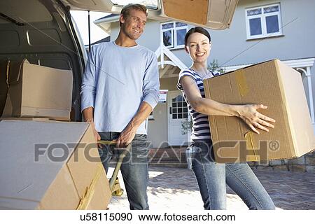 Couple moving house View Large Photo Image Stock Image - Couple moving house. Fotosearch