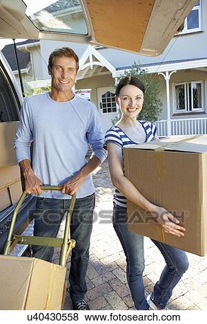 Stock Photo - Couple moving house. Fotosearch