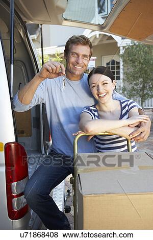 Stock Photo - Couple moving house. Fotosearch