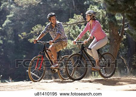 Couple on country bike ride View Large Photo Image Stock Photography - Couple on country bike ride. Fotosearch
