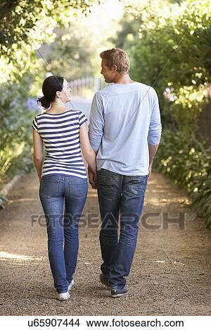 Couple on country walk View Large Photo Image Picture - Couple on country walk. Fotosearch