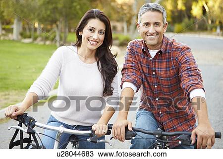 Couple On Cycle Ride In Countryside View Large Photo Image Stock Image - Couple On Cycle Ride In Countryside. Fotosearch