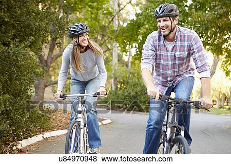 Couple On Cycle Ride In Countryside View Large Photo Image Stock Photo - Couple On Cycle Ride In Countryside. Fotosearch