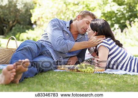 Stock Image - Couple on romantic picnic. Fotosearch