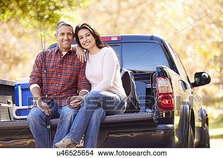 Couple Sitting In Pick Up Truck On Camping Holiday View Large Photo Image Picture - Couple Sitting In Pick Up Truck On Camping Holiday. Fotosearch