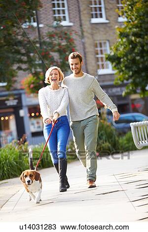 Couple Taking Dog For Walk In City Park View Large Photo Image Stock Image - Couple Taking Dog For Walk In City Park. Fotosearch