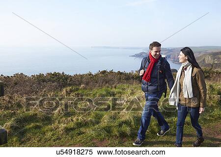 Couple Walking Along Coastal Path View Large Photo Image Stock Photography - Couple Walking Along Coastal Path. Fotosearch