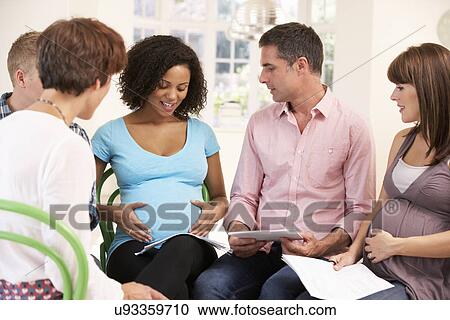 Stock Image - Couples at ante natal class. Fotosearch