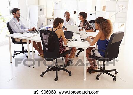 Creative Team Working In Office Of Start Up Business View Large Photo Image Stock Photo - Creative Team Working In Office Of Start Up Business. Fotosearch