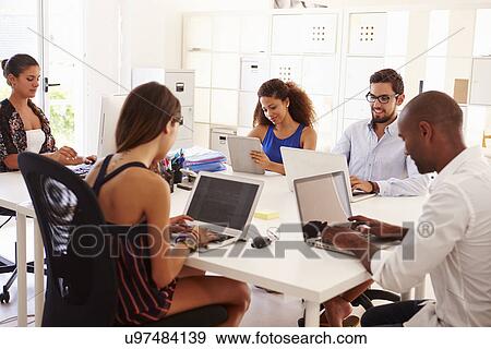 Creative Team Working In Office Of Start Up Business View Large Photo Image Stock Photo - Creative Team Working In Office Of Start Up Business. Fotosearch