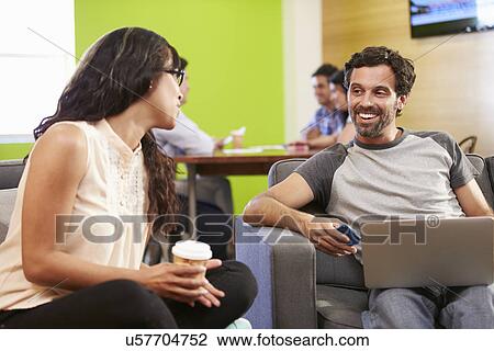 Creatives Having Informal Meeting On Sofas In Design Studio View Large Photo Image Stock Image - Creatives Having Informal Meeting On Sofas In Design Studio. Fotosearch