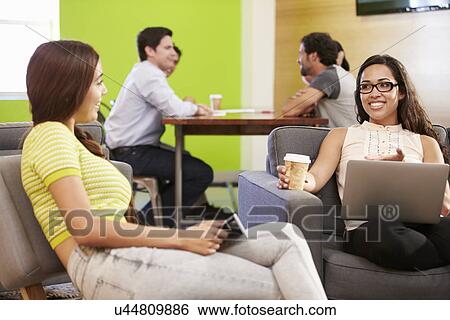 Creatives Having Informal Meeting On Sofas In Design Studio View Large Photo Image Stock Photograph - Creatives Having Informal Meeting On Sofas In Design Studio. Fotosearch