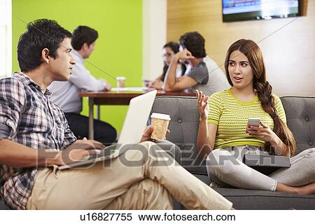 Creatives Having Informal Meeting On Sofas In Design Studio View Large Photo Image Stock Photography - Creatives Having Informal Meeting On Sofas In Design Studio. Fotosearch