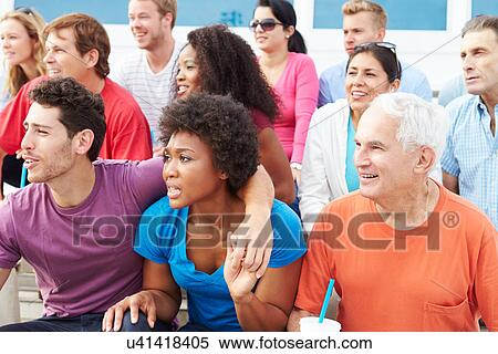 Stock Photography - Crowd Of Spectators Watching Outdoor Sports Event. Fotosearch