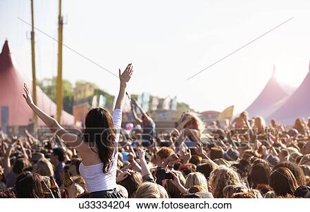 Crowds Enjoying Themselves At Outdoor Music Festival View Large Photo Image Picture - Crowds Enjoying Themselves At Outdoor Music Festival. Fotosearch