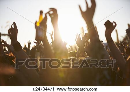 Crowds Enjoying Themselves At Outdoor Music Festival View Large Photo Image Stock Image - Crowds Enjoying Themselves At Outdoor Music Festival. Fotosearch