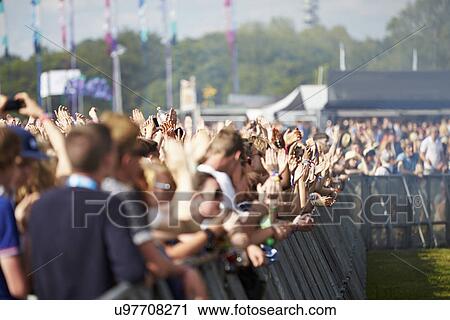 Crowds Enjoying Themselves At Outdoor Music Festival View Large Photo Image Stock Image - Crowds Enjoying Themselves At Outdoor Music Festival. Fotosearch