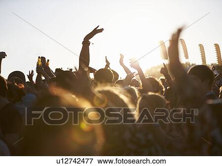 Crowds Enjoying Themselves At Outdoor Music Festival View Large Photo Image Stock Photo - Crowds Enjoying Themselves At Outdoor Music Festival. Fotosearch