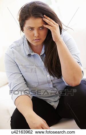 Depressed Overweight Woman Sitting On Sofa View Large Photo Image Stock Image - Depressed Overweight Woman Sitting On Sofa. Fotosearch
