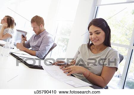 Stock Image - Design Team Collaborating On Project Together. Fotosearch