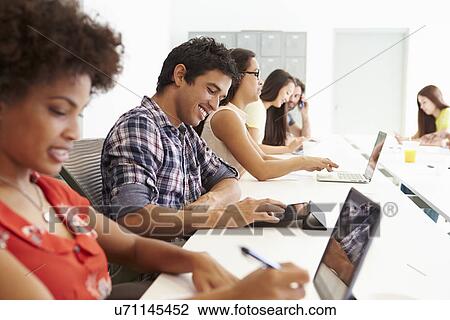 Design Team Collaborating On Project Together View Large Photo Image Stock Image - Design Team Collaborating On Project Together. Fotosearch